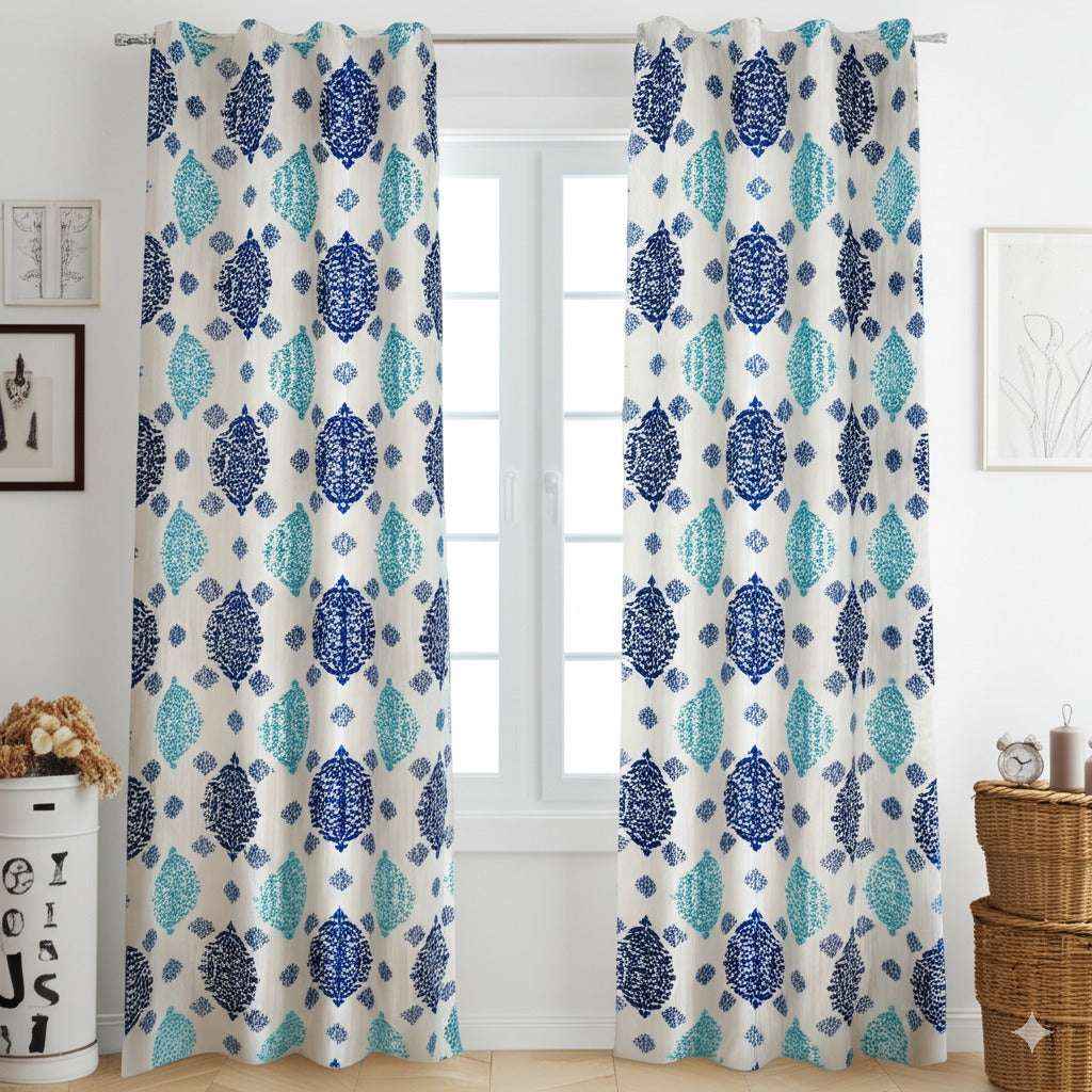 Blue and teal patterned curtains on white window in cozy living room interior