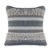 Square boho pillow with fringe and tribal pattern.