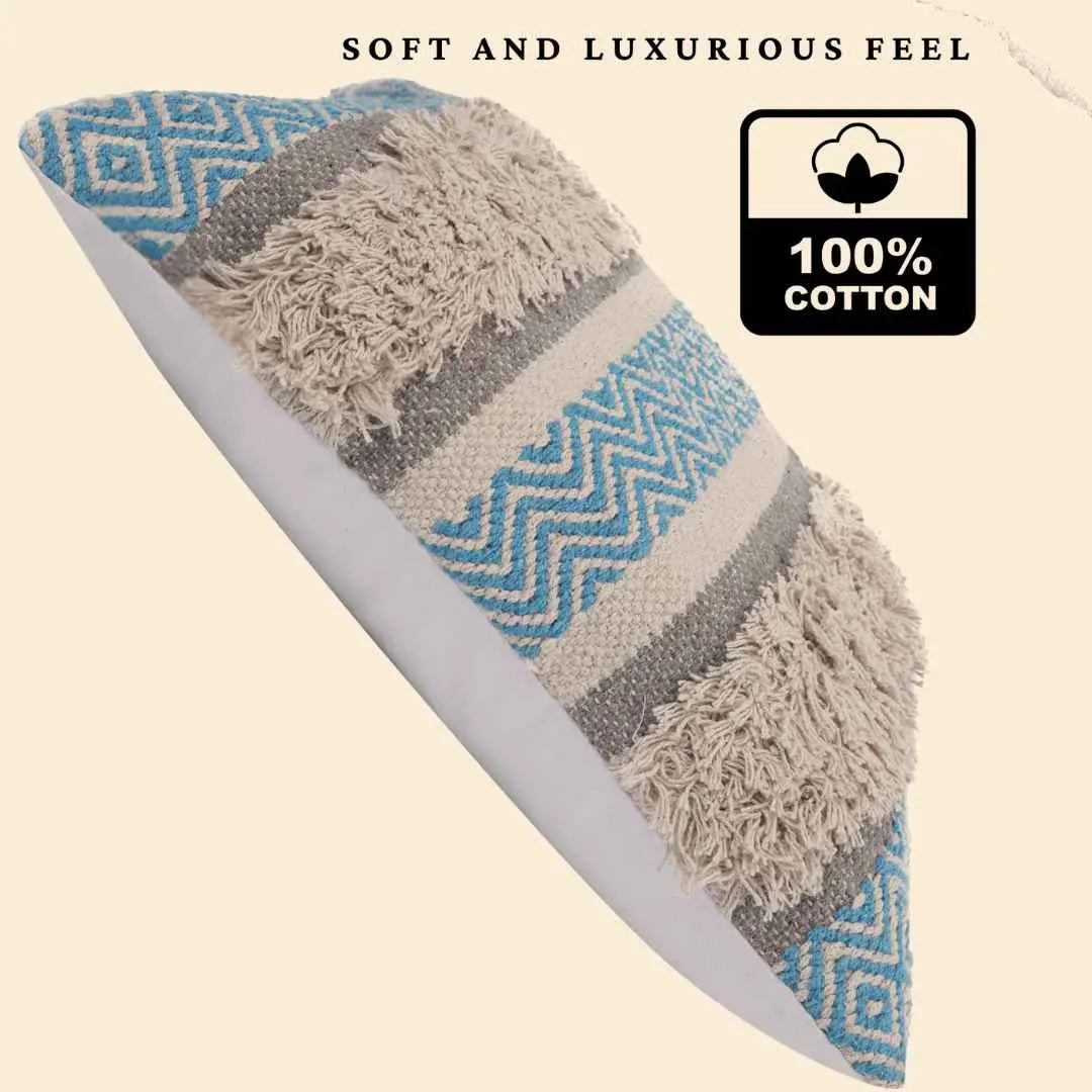 Boho throw pillow cover made from 100% cotton with blue chevron stripes, beige shaggy tufted accents, and gray woven bands, offering a soft and luxurious feel.