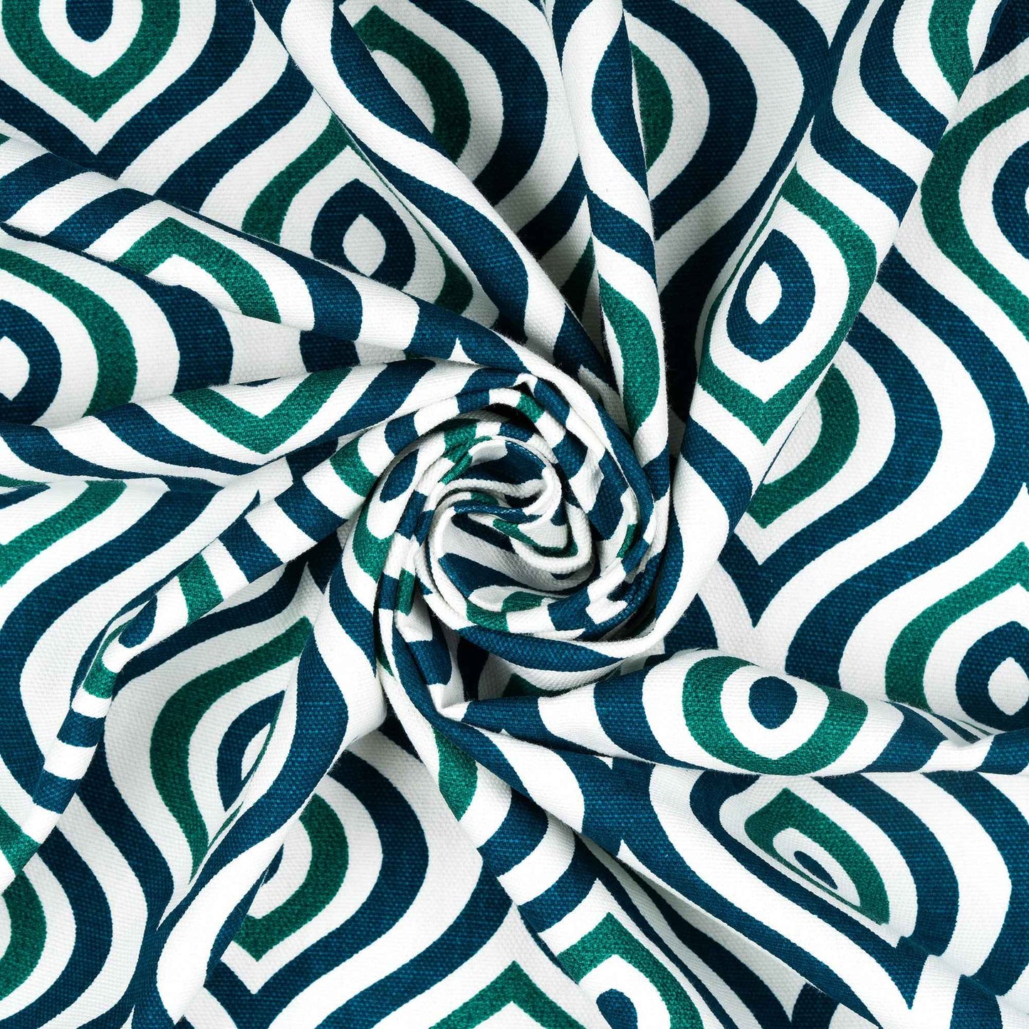 Close-up of twisted fabric with green and navy blue geometric diamond pattern on white background, highlighting texture and print detail.