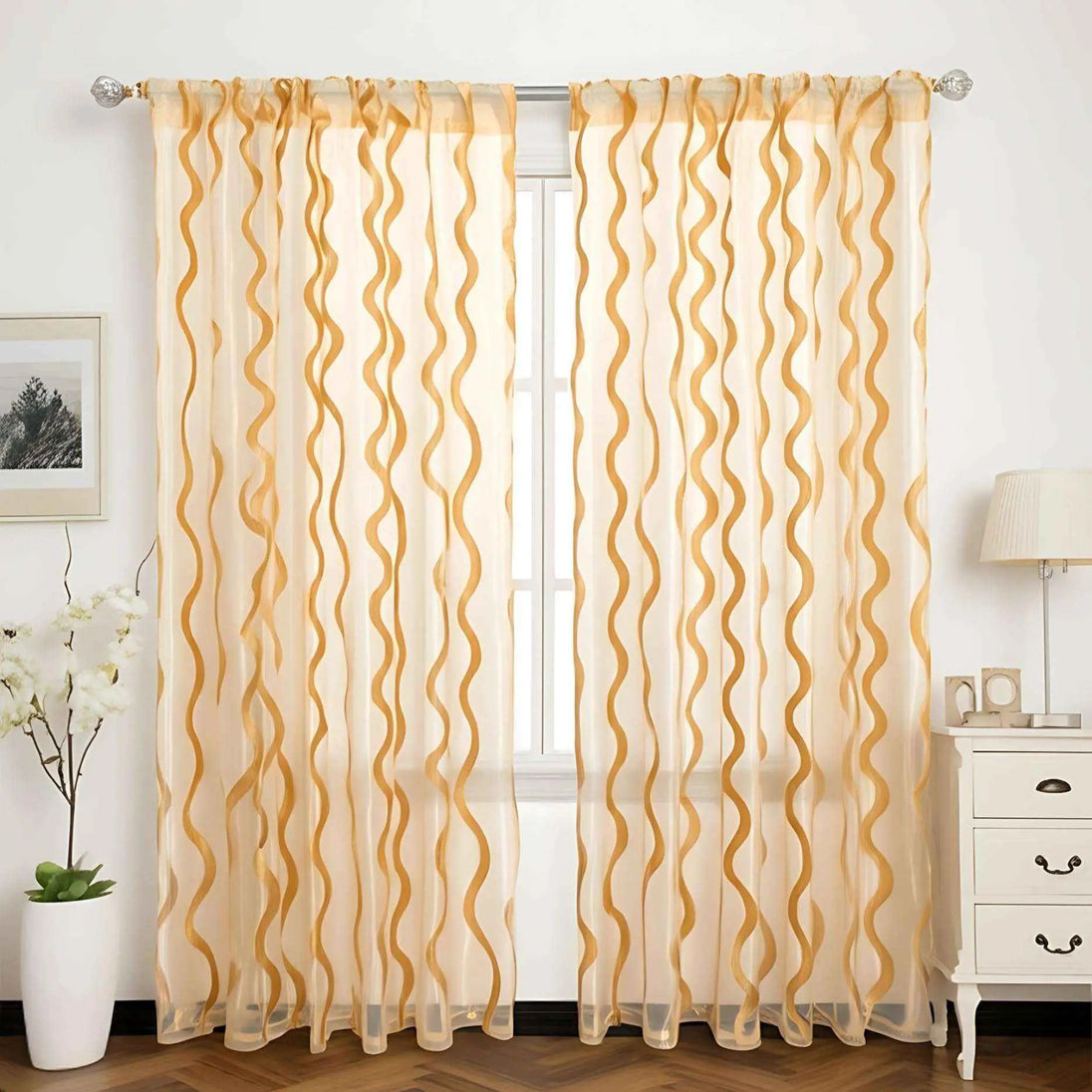 Elegant gold wave sheer curtains in bright room.
