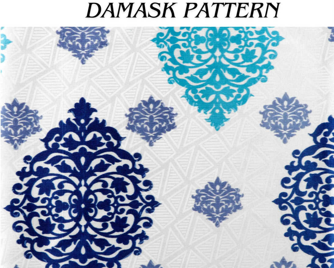 Close-up of teal and navy blue damask pattern.
