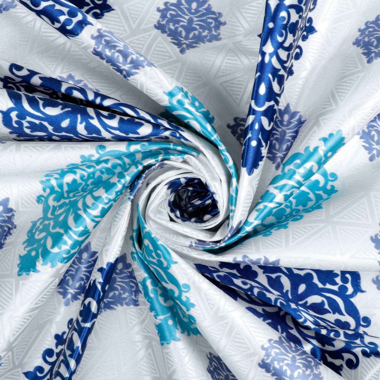 Twisted close-up of blue and teal damask fabric with textured geometric background