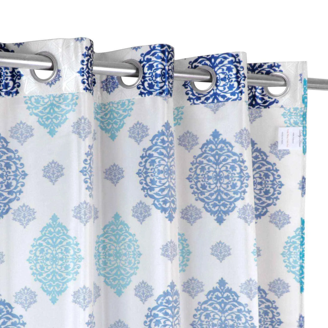Close-up of blue and teal printed curtain grommets.
