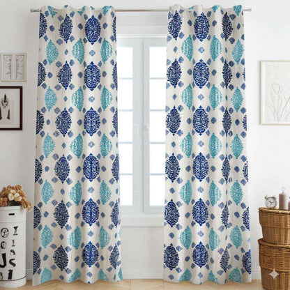 Blue and teal patterned curtains on white window in cozy living room interior