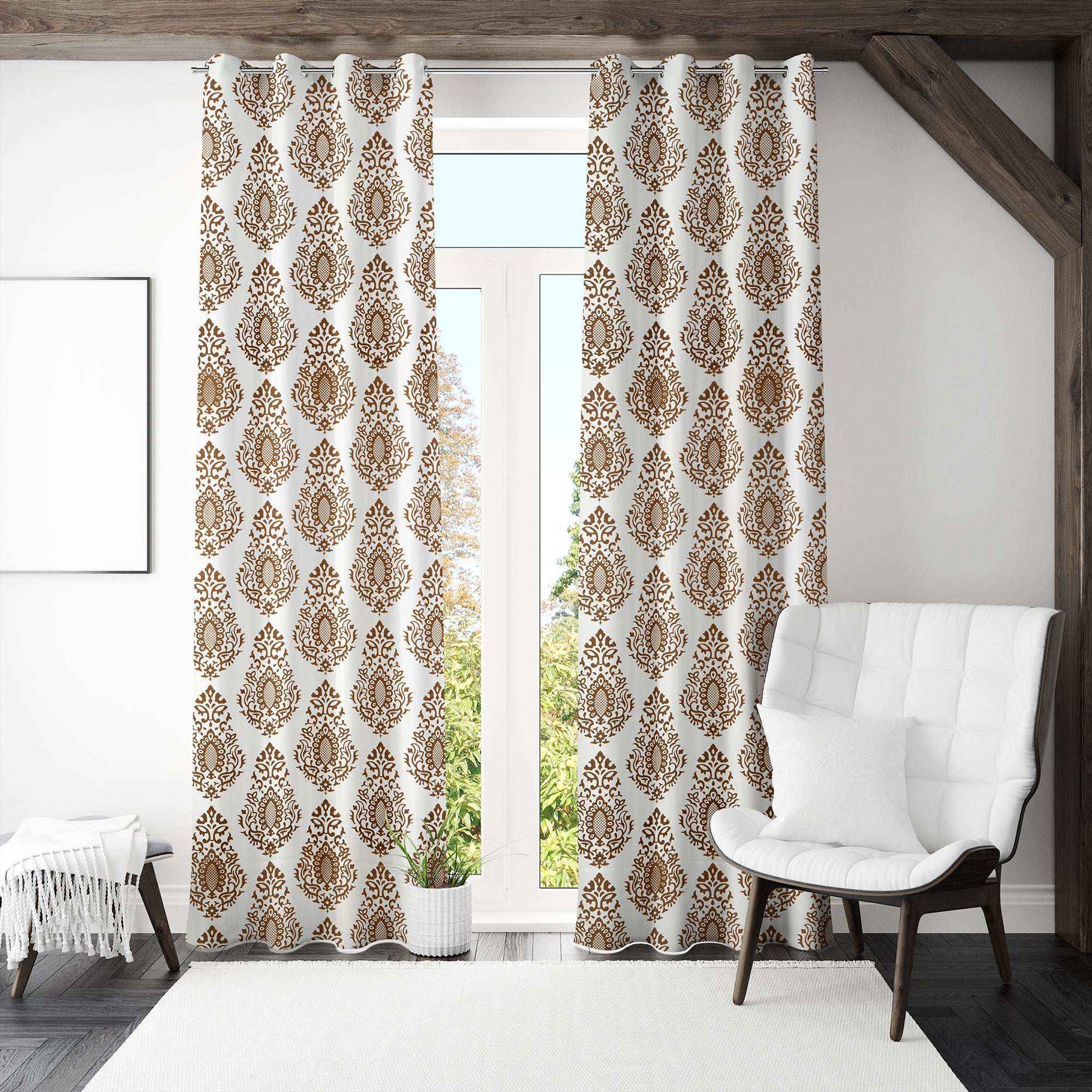 Bright living room featuring white curtains with brown damask pattern, hung on stainless steel grommets, styled with a white accent chair and modern decor.







