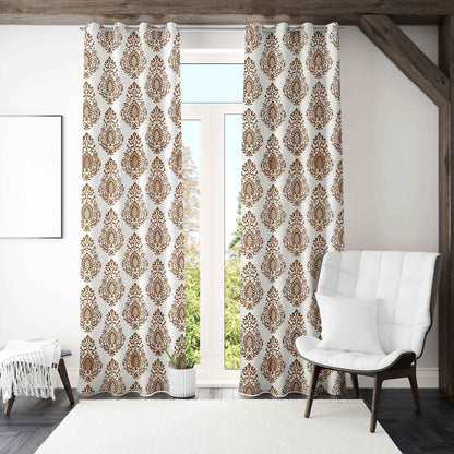 Bright living room featuring white curtains with brown damask pattern, hung on stainless steel grommets, styled with a white accent chair and modern decor.







