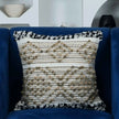 Boho decorative pillow on blue accent chair
