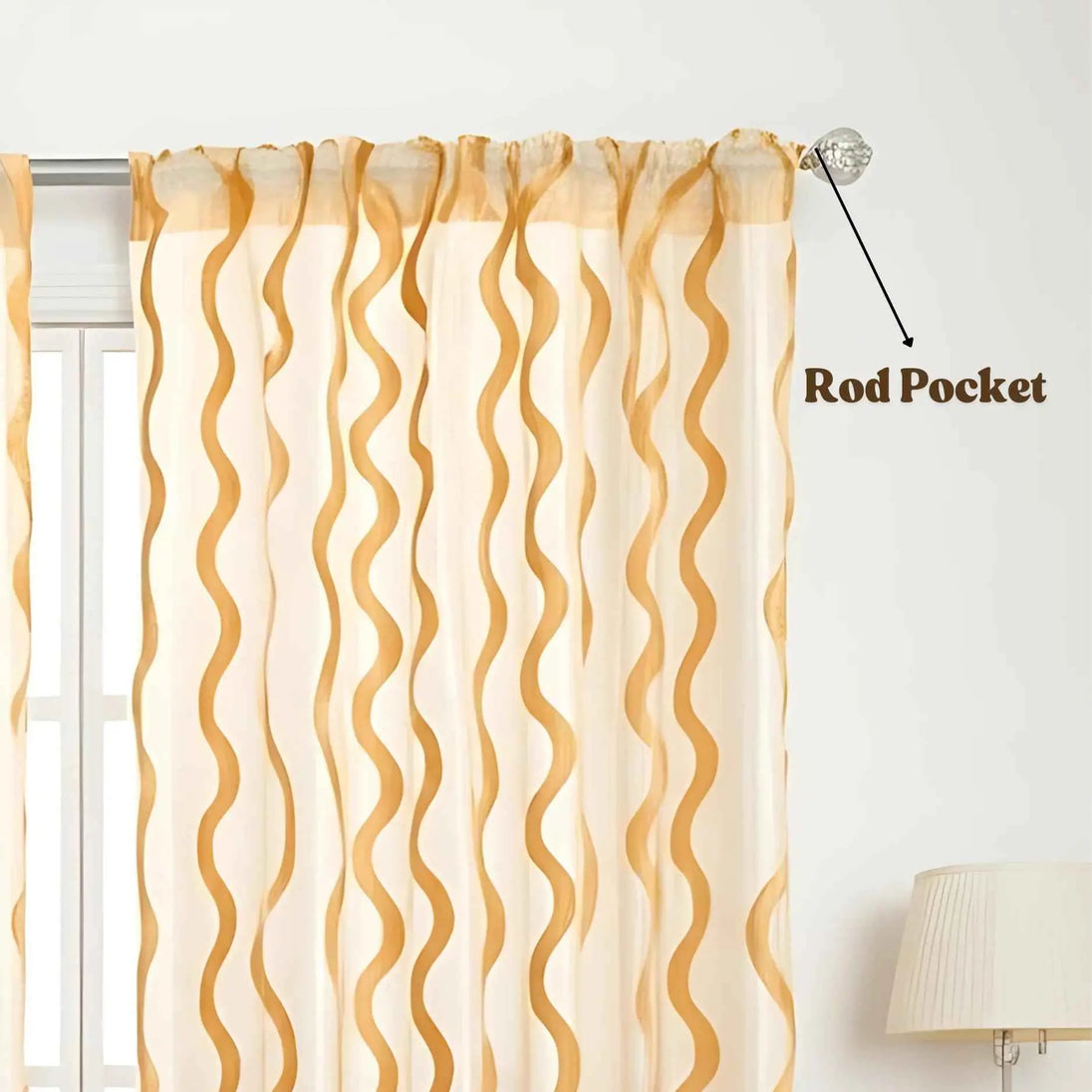 Gold wave sheer curtain with rod pocket top.
