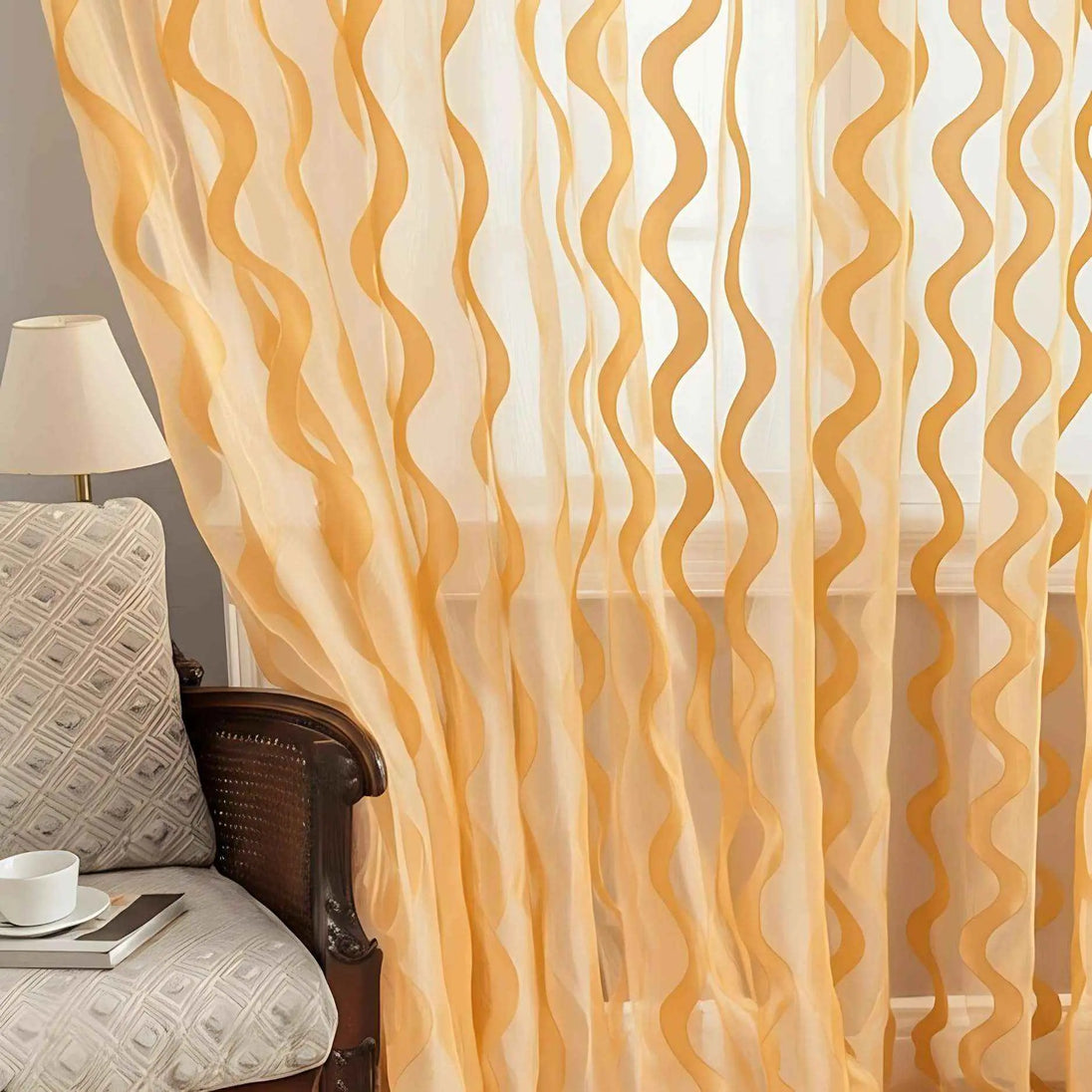 Cozy reading nook with golden wave sheer curtains.
