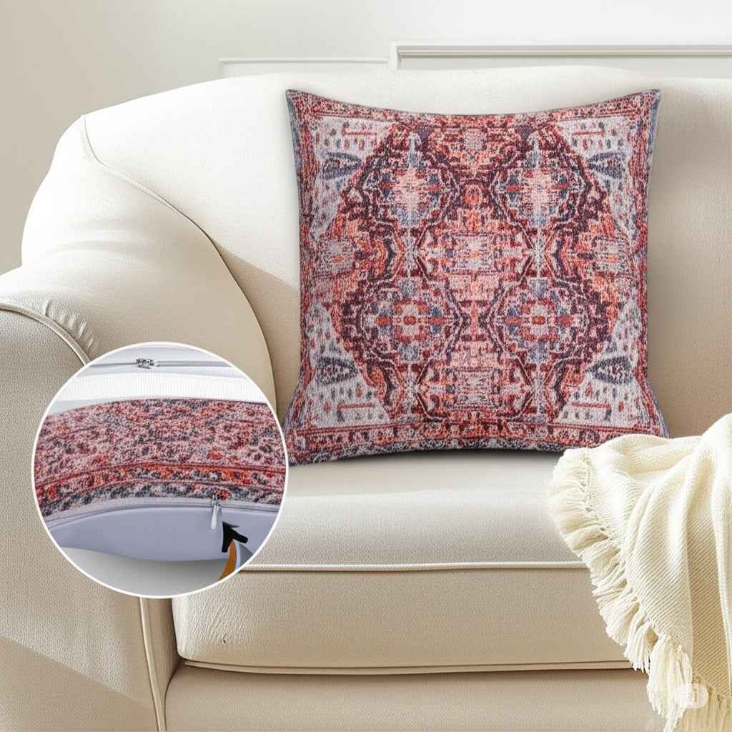 Boho-style red and gray patterned throw pillow on cream sofa with hidden zipper detail inset.
