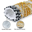 , textured surface with yellow tufted patterns and black-and-white tassel 