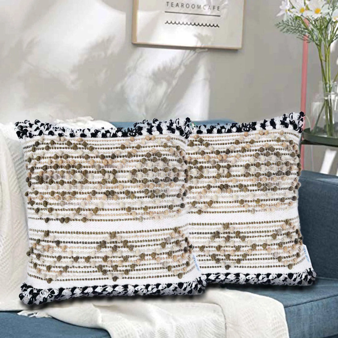 Boho throw pillow set on sofa with beige textured design and fringe