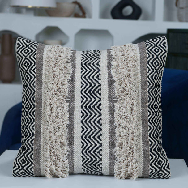Boho-style textured pillow with tribal geometric patterns.
