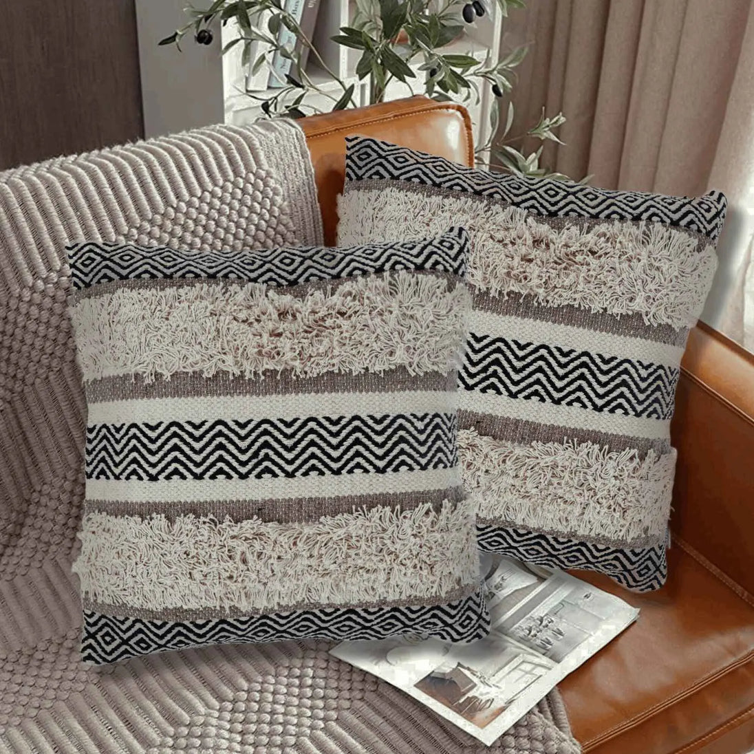 Boho tufted throw pillows on cozy sofa.
