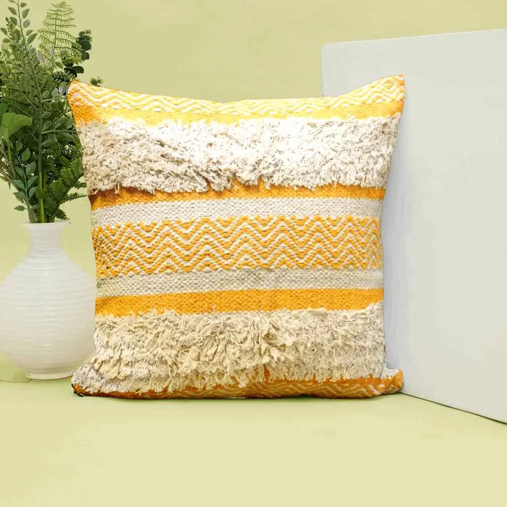 Vibrant yellow boho pillow with tufted texture.

