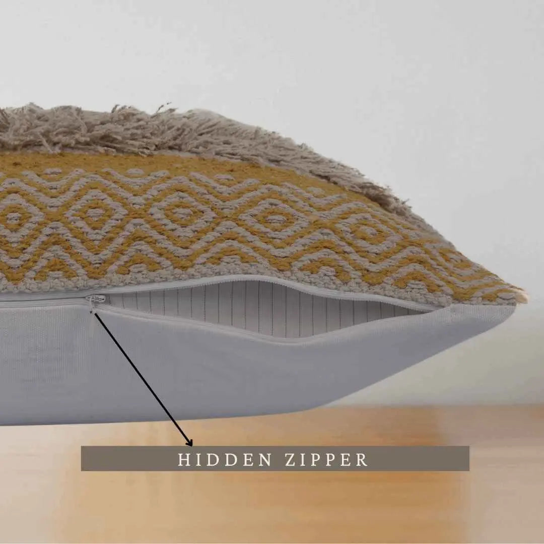 Boho pillow with hidden zipper and textured fabric.
