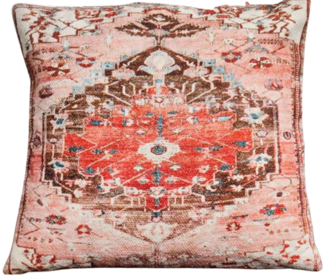 Tribal patterned pillows on decorative woven mat.
