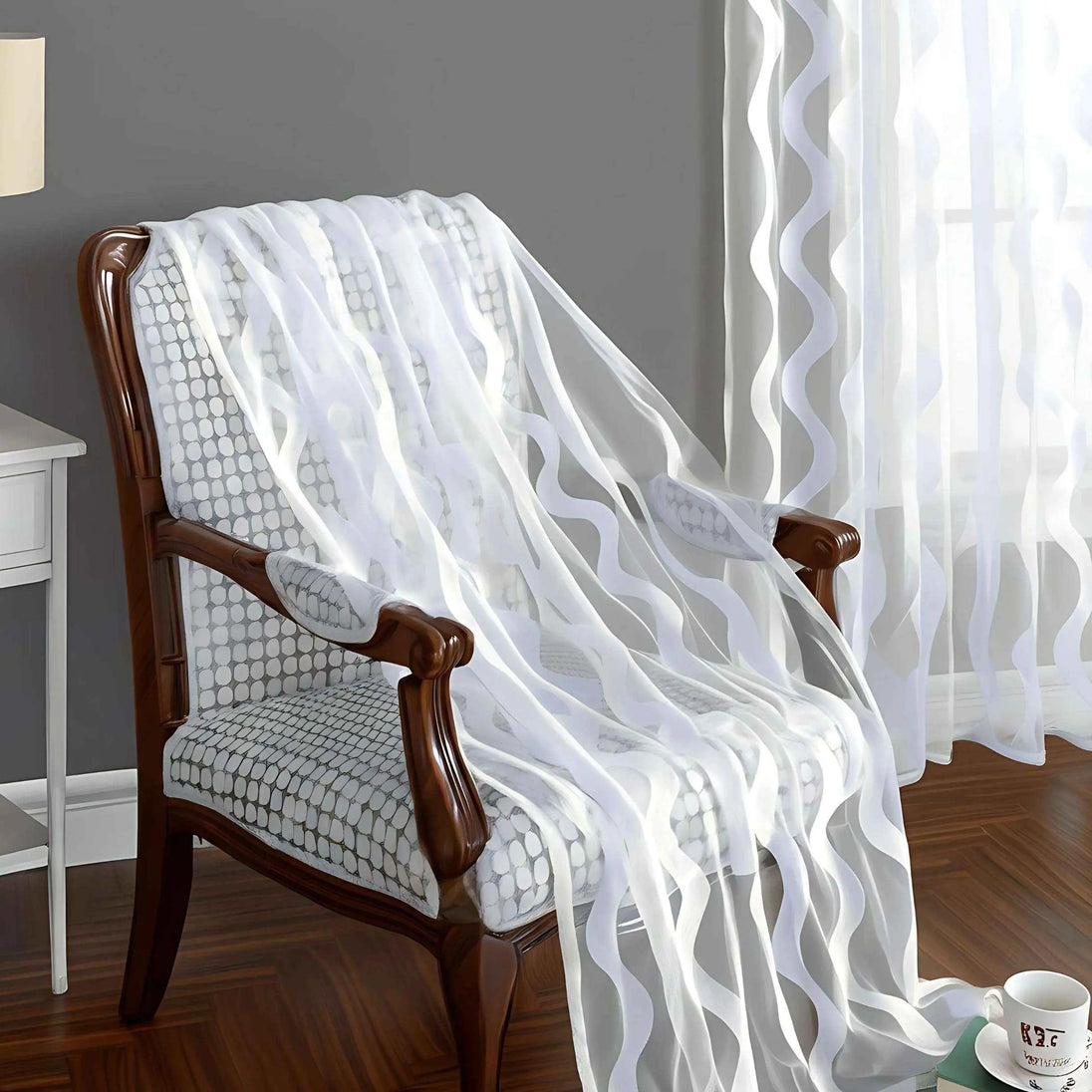 White quilted blanket draped over a wooden chair