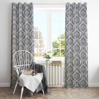 Elegant living room with large window framed by gray damask patterned cotton curtains, styled with white wooden chair, breakfast tray, and cozy decor.







