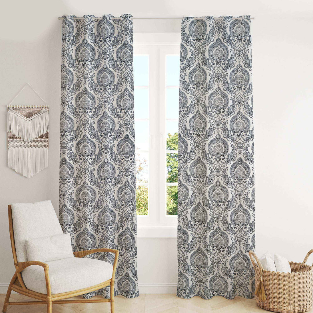 Gray damask curtains in bright cozy living space.
