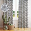 Elegant gray damask patterned curtains hanging in front of a window, 