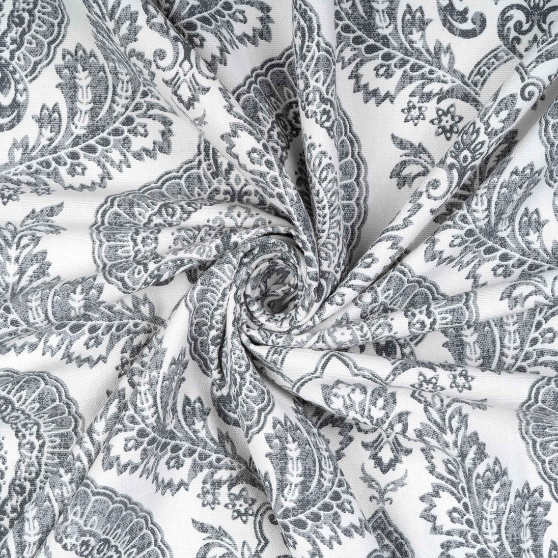 Twisted swirl of gray damask patterned cotton fabric 
