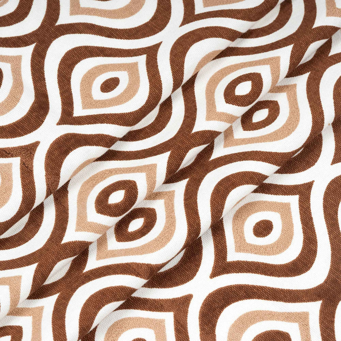 Folded fabric with retro brown geometric pattern.
