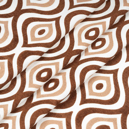 Close-up of folded brown and beige geometric patterned curtain fabric on white background, highlighting texture and print quality.