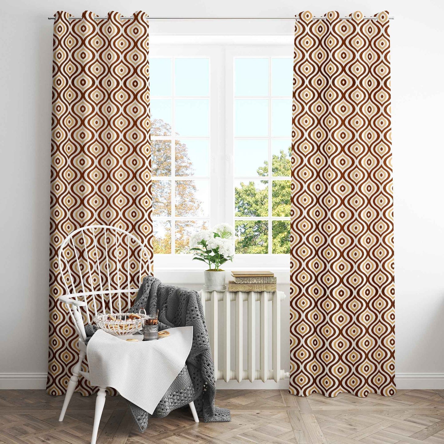Cozy breakfast nook with brown geometric patterned curtains, white chair, table setup, and large window with natural light.