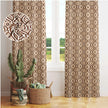 Boho-style room with brown patterned curtains.
