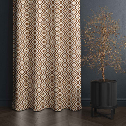 Brown geometric patterned curtain beside modern indoor plant in black planter, set against a dark textured wall.