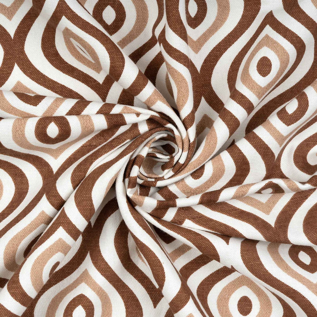 Brown and white geometric fabric with swirl fold.

