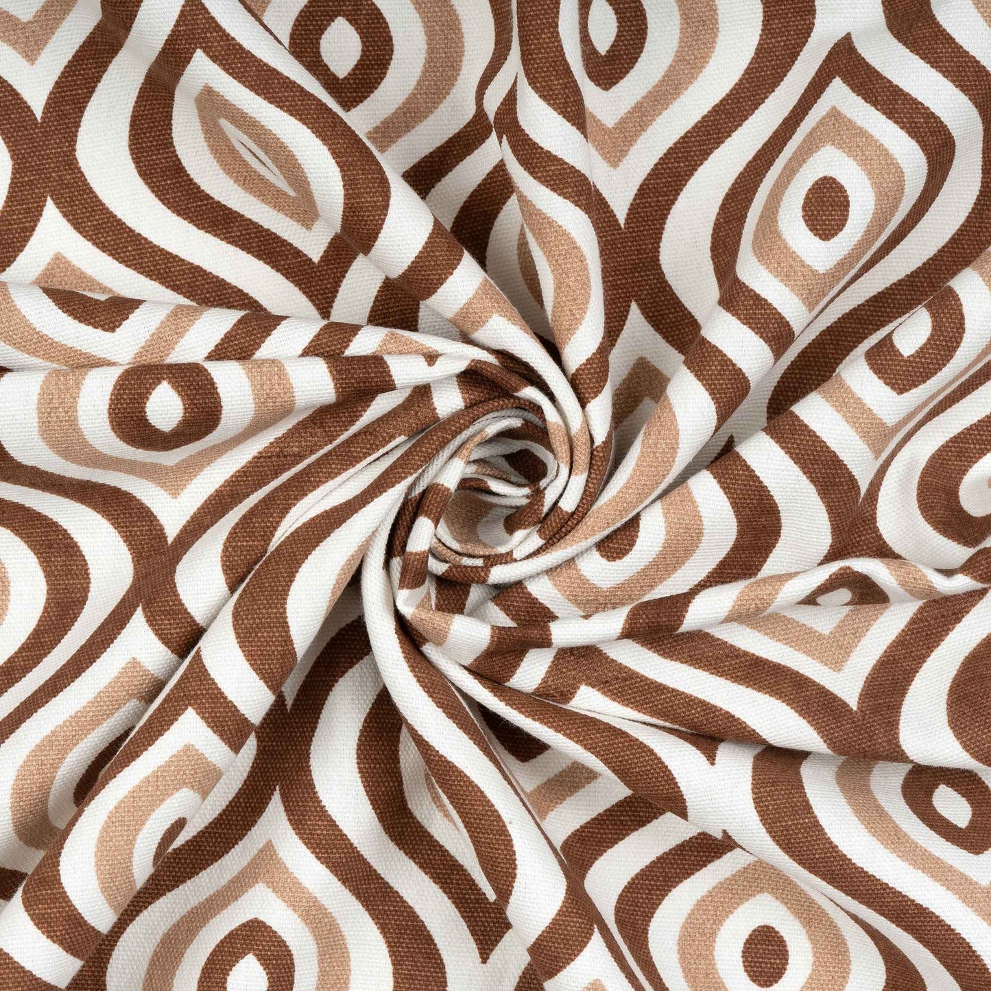 Close-up of twisted fabric with brown and beige geometric pattern on white background, showcasing texture and print detail.