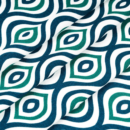 Folded fabric with bold green and navy blue diamond pattern on white background, ideal for modern curtains or upholstery.