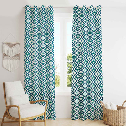 Boho-style room with teal and black geometric patterned curtains, wooden accent chair, woven basket, and macrame wall hanging.