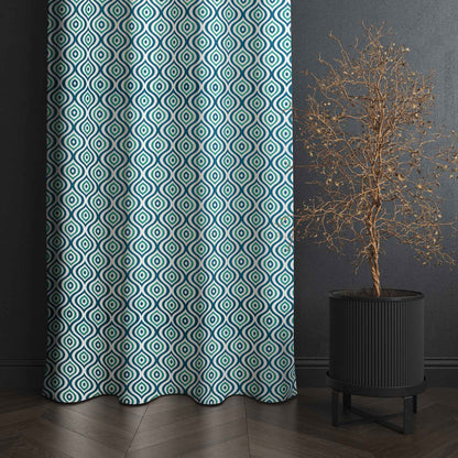 Teal and black geometric patterned curtain with dark textured wall and modern black planter featuring a decorative dried tree.