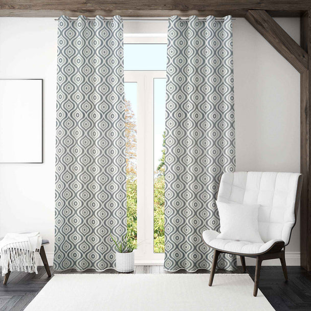 Modern geometric curtains in bright minimalist room.
