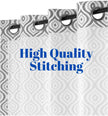 Geometric curtains featuring high-quality stitching and grommets.
