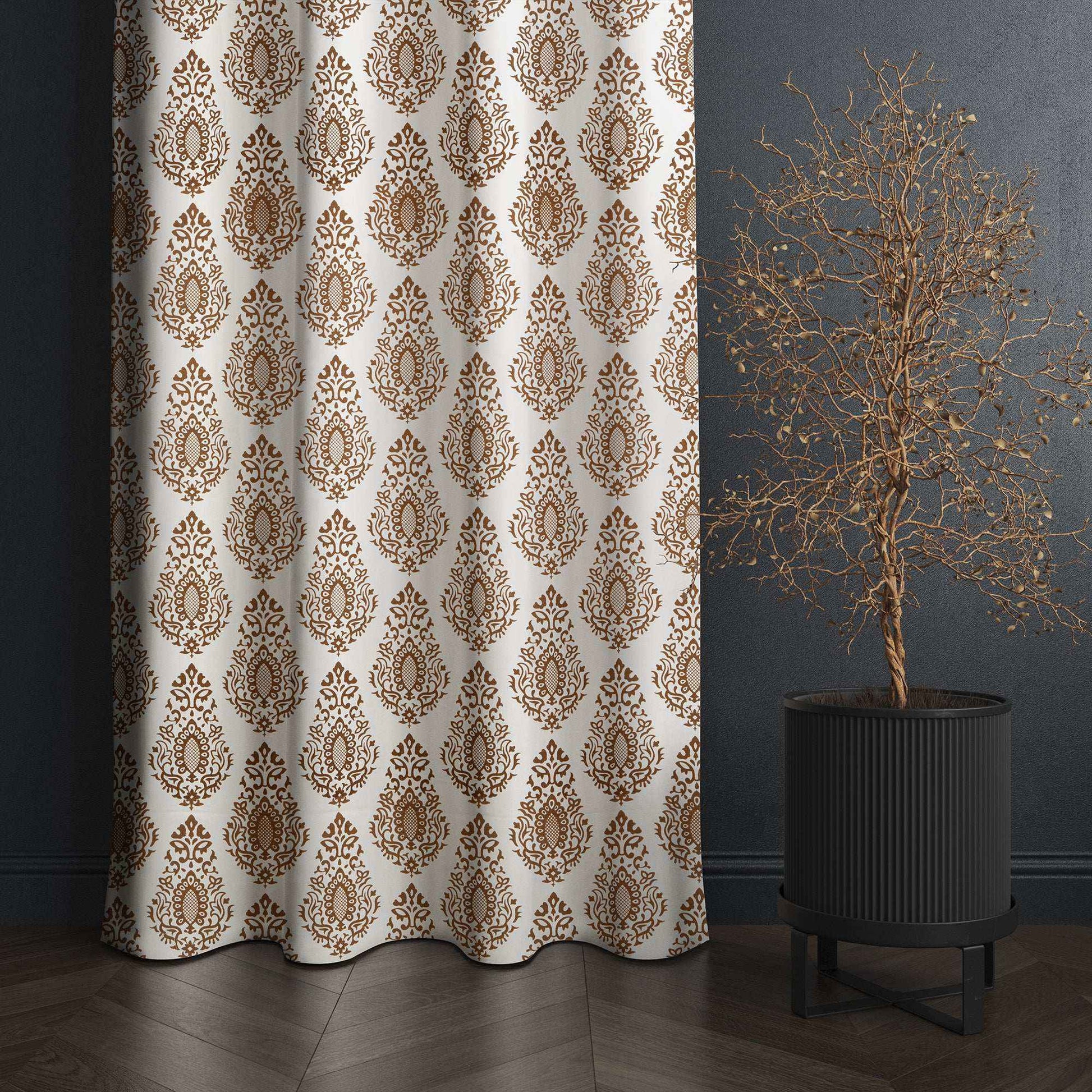 Brown damask pattern curtain panel hanging in modern room with dark walls and decorative plant, perfect for elegant home decor.







