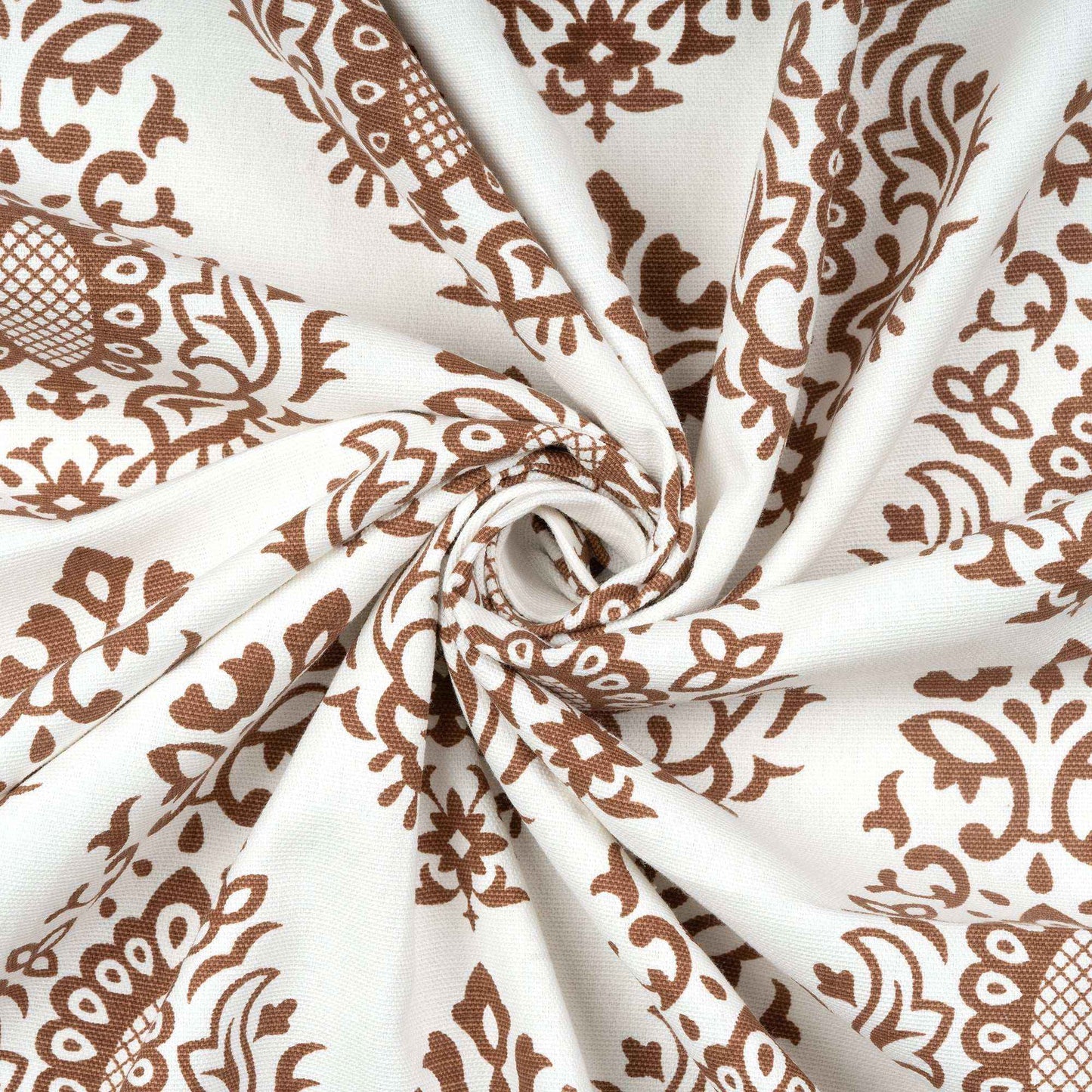 Close-up of twisted cotton fabric with brown damask print, highlighting soft texture and elegant pattern for home curtain design.