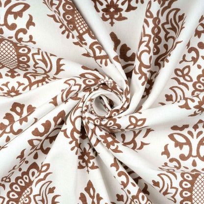 Close-up of twisted cotton fabric with brown damask print, highlighting soft texture and elegant pattern for home curtain design.