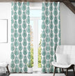 Green damask curtains brighten cozy attic living space
