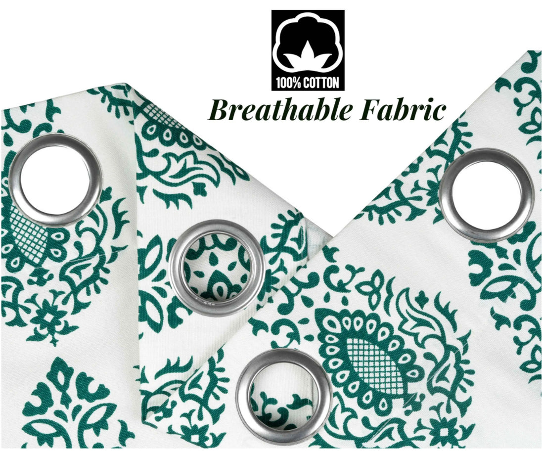 Close-up of folded fabric with green floral print.
