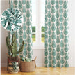 Green damask curtains with close-up fabric texture; styled with woven baskets and indoor plants.
