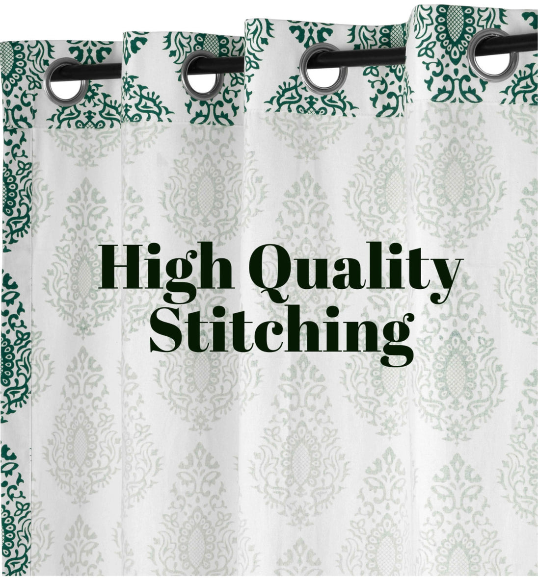 White curtains with green damask print and grommets.
