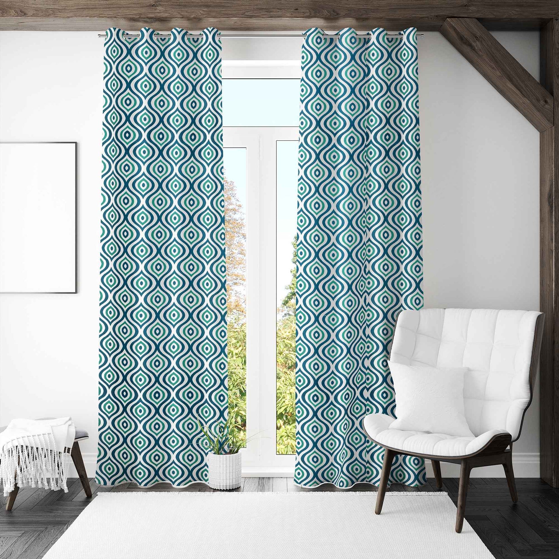 Modern living room with teal and black diamond patterned curtains, white armchair, and full-length glass door letting in natural light.