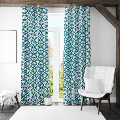 Modern living room with teal and black diamond patterned curtains, white armchair, and full-length glass door letting in natural light.