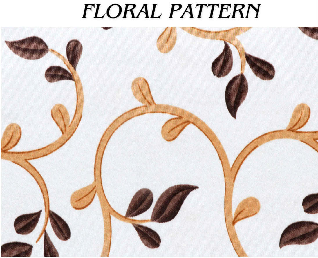 Colorful Aztec throw pillows on cozy grey couch.
