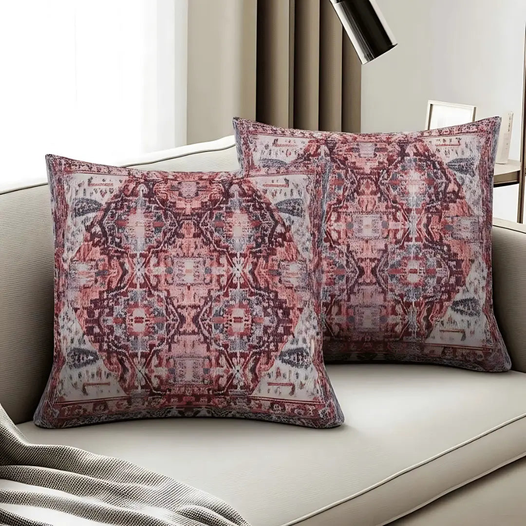 Patterned pillows on a sofa with a neutral background